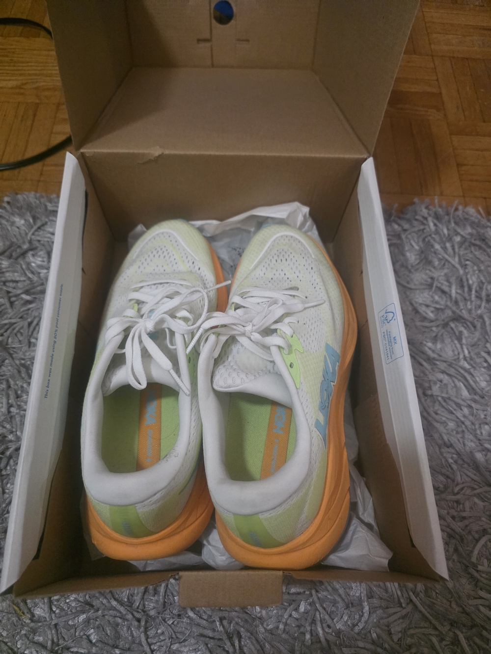 Hoka White Sneakers with Orange Sole and Light Green Accents